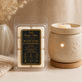 Midnight Cashmere 2.7 oz wax melts beside a wax warmer